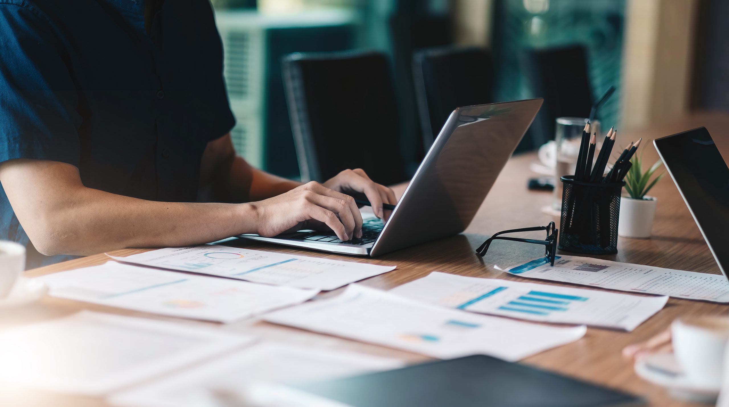 man working in finance and accounting Analyze financial budget at office.